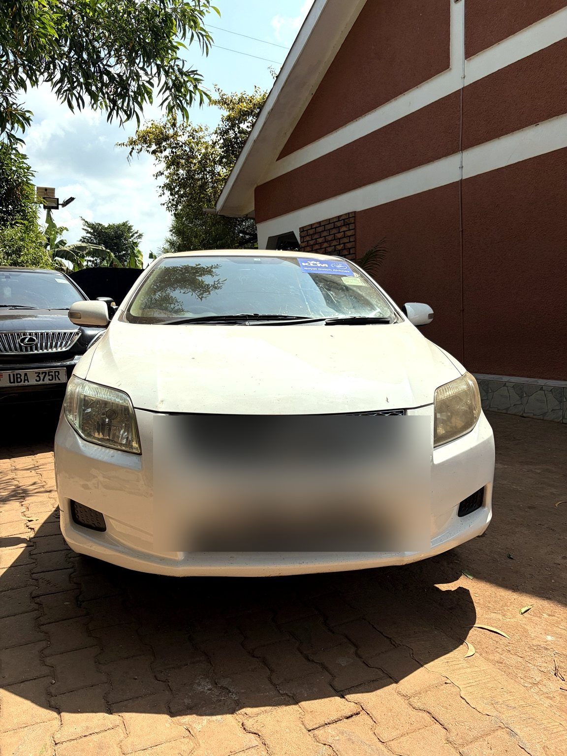 White station wagon available for rental in Uganda